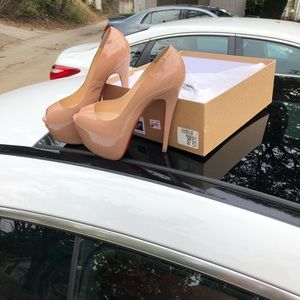 Christian Louboutin patent leather pumps